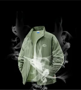 Macro shot of green sun protection jacket showing smoke passing through breathable fabric