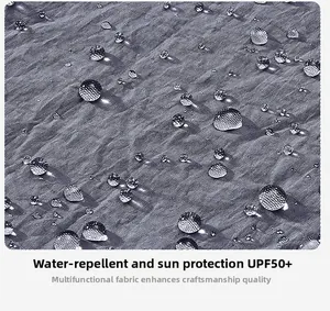 Detailed macro view of water-repellent UPF50+ fabric with grey grid texture pattern