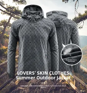 Detail of dark grey sun protection jacket with letter B pattern and breathable fabric