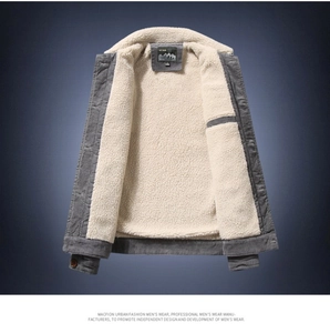 Detail of grey corduroy jacket with thick off-white sherpa fleece lining and textured ribs
