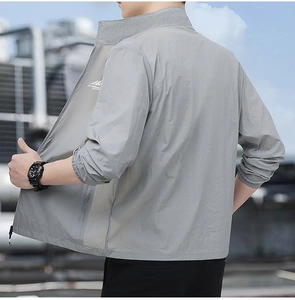 Detail view of lightweight sun protection jacket fabric with printed mountain logo on back