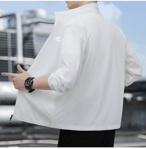 Detail of white sun protection jacket with outdoor embroidery and stand-up collar