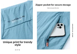 Détail de la veste anti-UV bleu clair avec poche à fermeture éclair orange et marquage