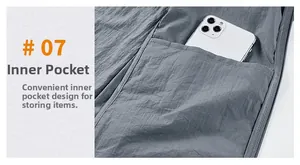 Detail view of the inner pocket on a grey sun protection jacket holding a smartphone