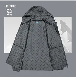 Detail of hooded sun protection jacket in dark grey with all-over letter B pattern