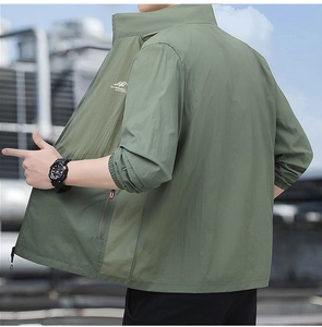 Detail of olive green quick-dry sun protection jacket with elastic cuffs and stand collar