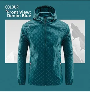 Detail view of the denim blue lightweight sun protection jacket with all-over B letter prints