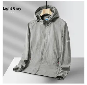Detail of light gray outdoor sun protection jacket with adjustable hood and texture fabric