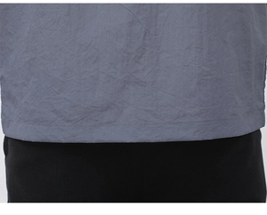 Detailed close-up showing the neat hem stitching and lightweight gray sun protection fabric