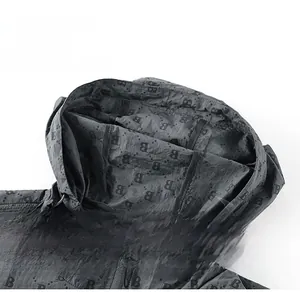 Detailed view of the drawstring hood and B-pattern printed fabric on sun-protective jacket