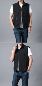 Detailed view of black multi-pocket utility vest with D-ring and durable zippers