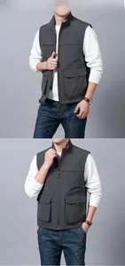 Detail of grey outdoor vest featuring large utility flap pockets and a high collar