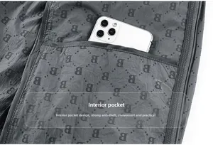Detail of grey lightweight jacket featuring B-pattern and a functional inner pocket