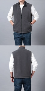 Detail view of men's dark grey fleece vest with stand collar and zipper closure