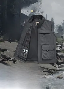 Detail of dark grey outdoor vest showing multiple pockets and breathable mesh lining