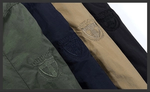 Close-up of four colors durable outdoor fabric with shield embroidery and texture