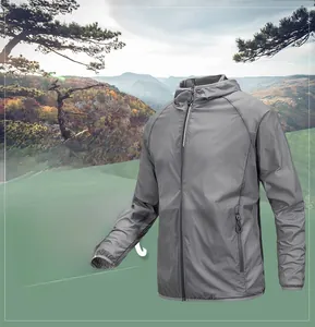 Detail of grey men's sun protection jacket showing zip pockets and elastic cuffs