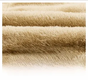 Macro shot of thick light brown faux shearling lining for winter thermal jackets