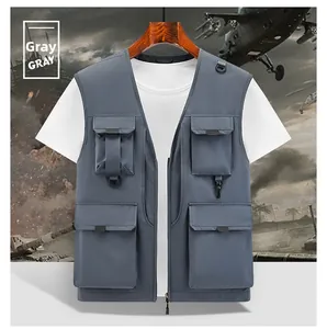 Detail view of deep gray tactical vest showing 4 large cargo pockets and D-ring hooks