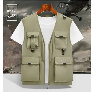 Detail of khaki multi-pocket tactical vest with metallic D-rings and zipper closures