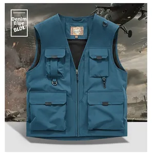 Close-up of denim blue fishing vest with functional multi-pockets and D-ring hooks