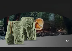 Detailed front and back views of army green cargo shorts with large flap pockets