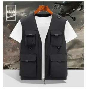 Detail of black tactical fishing vest with multiple utility pockets and D-ring hooks