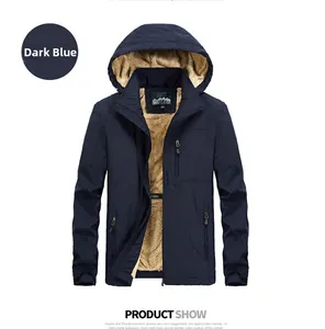 Detail of men's navy blue winter parka with thick beige fleece lining and hood