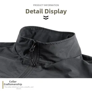 Detailed view of the stand collar and zipper on this gray outdoor multi-pocket vest