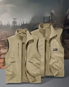 Detail view of khaki reversible work vest showing fleece lining and durable windproof fabric