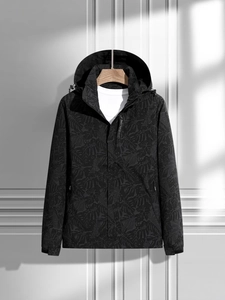 Waterproof black camouflage windbreaker jacket with EXPLORE zipper detail for outdoor hiking