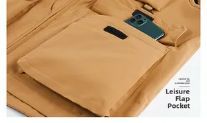 Detail of multi-pocket tactical vest showing flap pocket with velcro and smartphone storage