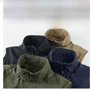 Detail view of double-sided outdoor utility vests in black, khaki, navy and green