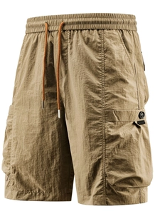 Men's khaki cargo shorts with elastic drawstring waist and large tactical side pockets