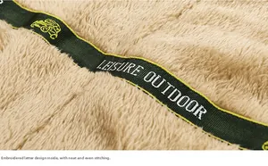 Close-up of warm fleece lining and embroidered leisure outdoor strap on men's coat