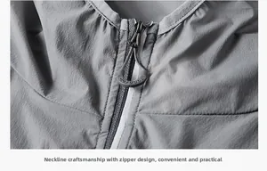 Detail of grey sun protection jacket showing the partial zipper and outdoor branding