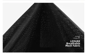 Close-up detail of the breathable black mesh fabric on the outdoor utility vest