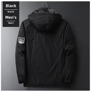 Detail of black winter parka with faux fur lining and embroidered sleeve patch for warmth