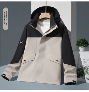 Detail of outdoor waterproof jacket showing velcro cuffs and mountain sleeve patch