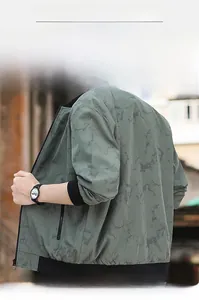 Detail view of men's bomber jacket with dark green marble pattern and ribbed collar