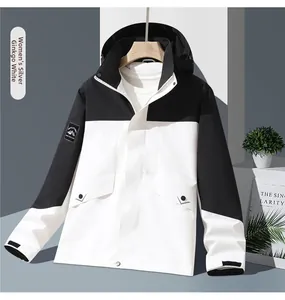 Detail of Ginkgo White outdoor hooded jacket with adjustable cuffs and mountain emblem