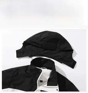 Detail of outdoor jacket showing detachable hood, stand collar and white mesh lining
