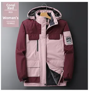 Close-up of women's coral pink hiking jacket with thick gray fleece lining and hood