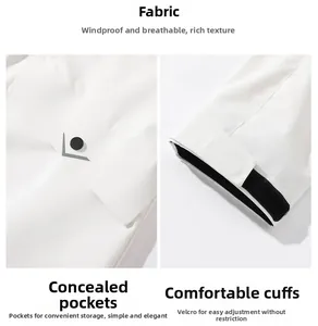 Detail of white outdoor jacket showing windproof fabric, hidden pockets, and velcro cuffs