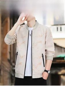 Detail of light beige bomber jacket with marble pattern and contrasting black zippers