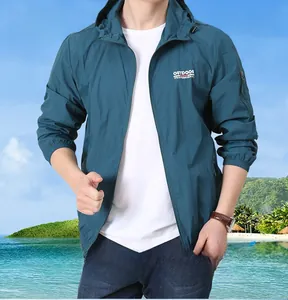 Detail of lightweight sun protection jacket with hood and functional arm pocket for men