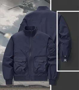 Detail view of navy blue bomber jacket with ribbed cuffs and tactical arm pockets