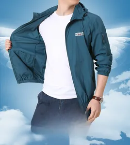 Detail of peacock blue men's sun protection jacket featuring hooded outdoor logo design