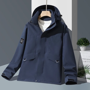 Waterproof outdoor hooded jacket in navy blue with mountain patch and reflective pockets