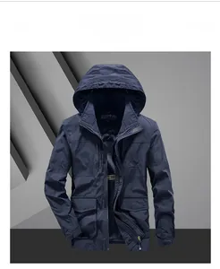 Close-up of a blue outdoor hooded jacket featuring an adjustable collar and brand embroidery